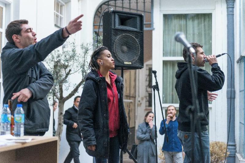 Artist collective performa rap in a courtyard.jpg.jpg