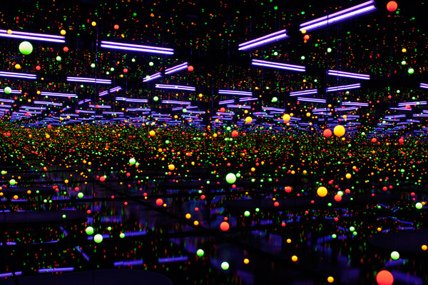 Spectacular art installation of coloured lights infinitely reflecting in a dark room flanked by mirrors.jpg