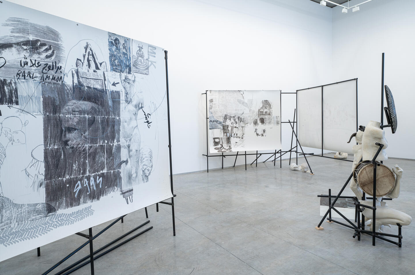 White art space displaying graphite sketches and white mannekins taken apart.jpg
